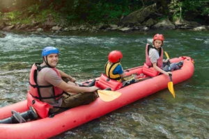 family starting out rafting on a river